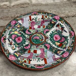 Colorful Decorative Plate with Floral and Figurative Design